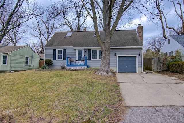 view of front of house with a garage and a front yard