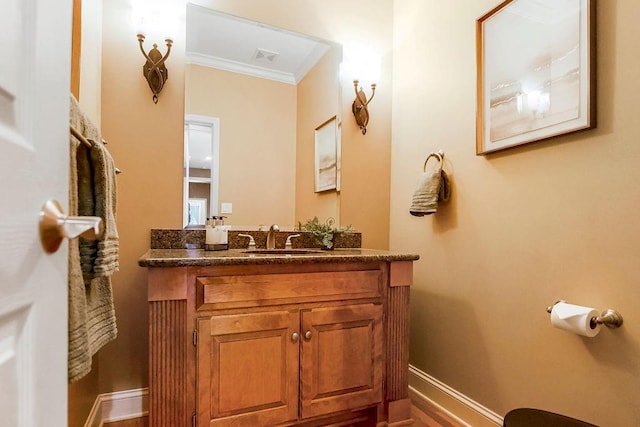 bathroom featuring vanity and crown molding