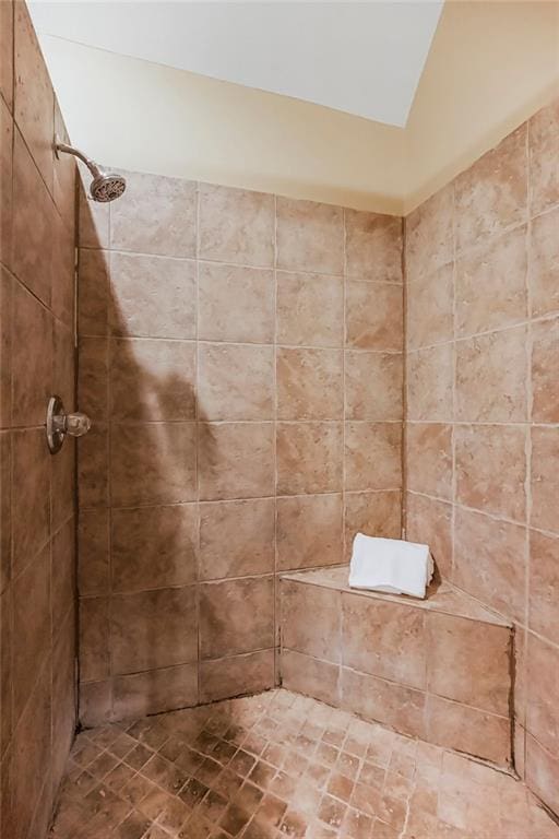 bathroom with a tile shower