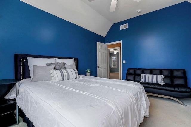 carpeted bedroom featuring ceiling fan and vaulted ceiling