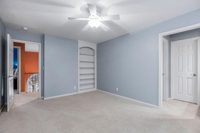 unfurnished bedroom with light colored carpet and ceiling fan