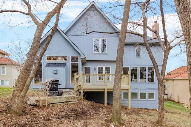 back of house featuring a wooden deck