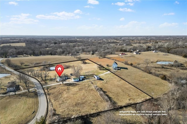 birds eye view of property featuring a rural view