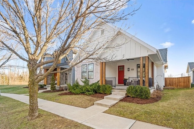 view of front of home featuring a front yard and covered porch