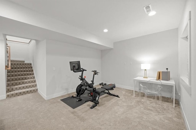 exercise room with light carpet