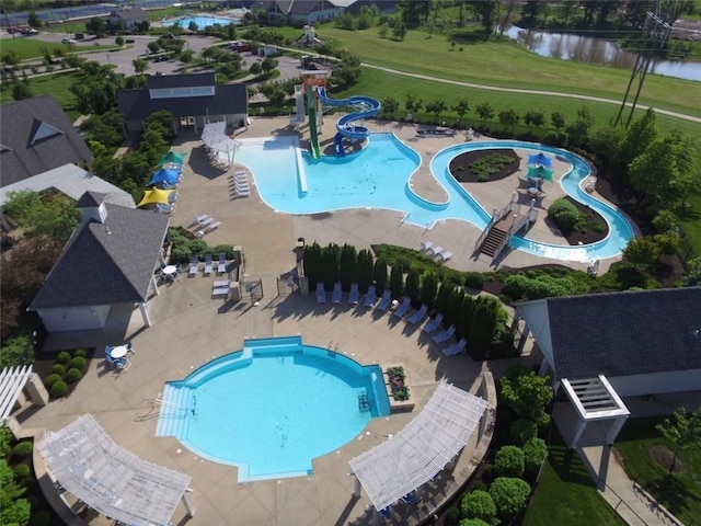 view of pool with a water view and a water slide