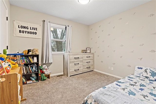 carpeted bedroom featuring a textured ceiling