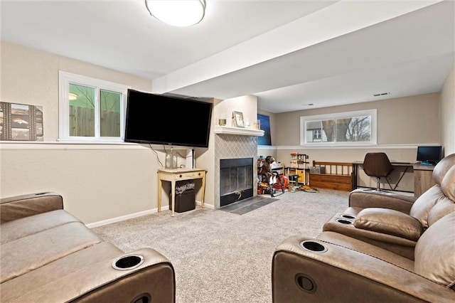 carpeted living room with a fireplace