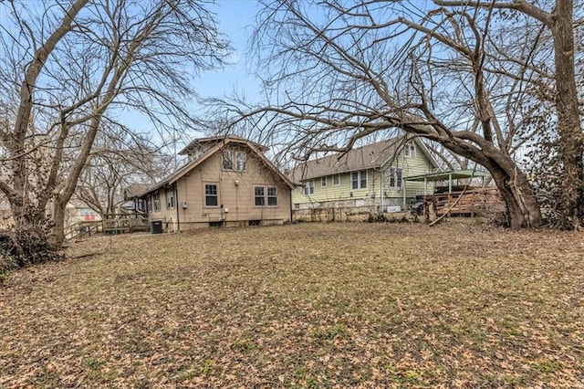 rear view of property featuring fence