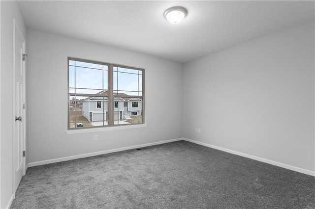 empty room featuring carpet floors