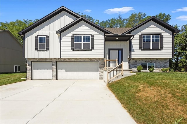 1320 N Holland Ct, Independence, MO 64056 - bi-level home featuring an attached garage, board and batten siding, a front lawn, and driveway