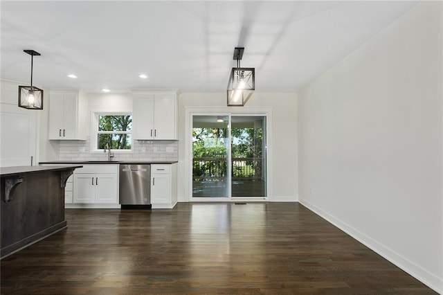 1320 N Holland Ct, Independence, MO 64056 - kitchen with stainless steel dishwasher, backsplash, recessed lighting, white cabinetry, and dark wood-style floors