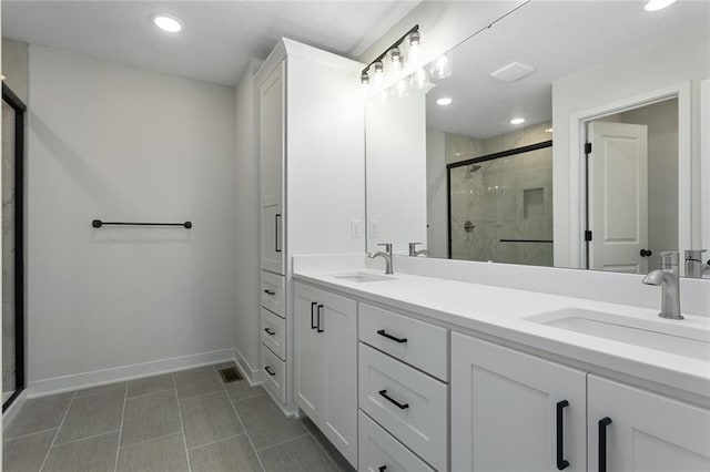 1320 N Holland Ct, Independence, MO 64056 - full bathroom with a shower stall, double vanity, tile patterned flooring, and recessed lighting