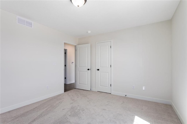 1320 N Holland Ct, Independence, MO 64056 - unfurnished bedroom featuring carpet and a closet