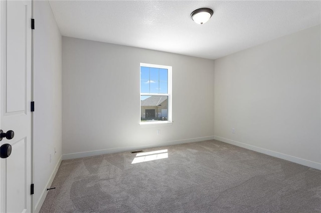 1320 N Holland Ct, Independence, MO 64056 - carpeted spare room featuring baseboards
