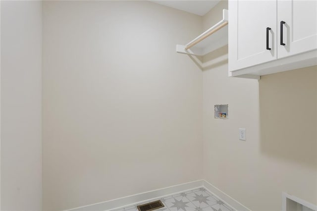 1320 N Holland Ct, Independence, MO 64056 - laundry area with cabinet space and hookup for a washing machine