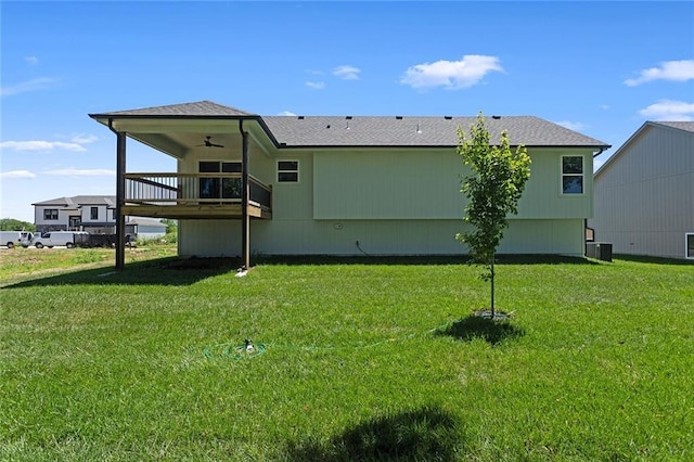 1320 N Holland Ct, Independence, MO 64056 - rear view of property with a ceiling fan and a yard