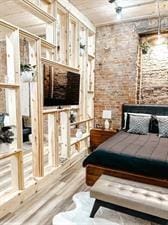 218/220 N Main St, Maryville, MO 64468 - bedroom with brick wall