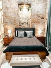 218/220 N Main St, Maryville, MO 64468 - bedroom featuring brick wall