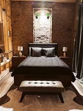 218/220 N Main St, Maryville, MO 64468 - bedroom featuring brick wall