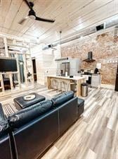 218/220 N Main St, Maryville, MO 64468 - cinema room featuring ceiling fan, light hardwood / wood-style flooring, and wooden ceiling