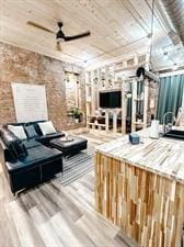 218/220 N Main St, Maryville, MO 64468 - interior space featuring hardwood / wood-style flooring, wooden ceiling, ceiling fan, and brick wall