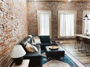 218/220 N Main St, Maryville, MO 64468 - sitting room featuring brick wall and hardwood / wood-style floors