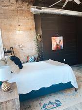 218/220 N Main St, Maryville, MO 64468 - bedroom with brick wall