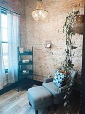 218/220 N Main St, Maryville, MO 64468 - living area with brick wall and wood-type flooring