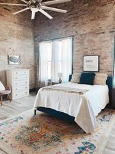 218/220 N Main St, Maryville, MO 64468 - bedroom featuring brick wall