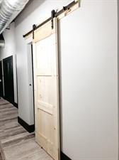 218/220 N Main St, Maryville, MO 64468 - hallway featuring a barn door and light wood-type flooring