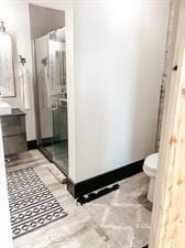 218/220 N Main St, Maryville, MO 64468 - bathroom with vanity, an enclosed shower, and toilet