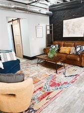 218/220 N Main St, Maryville, MO 64468 - home theater room featuring a barn door and light wood-type flooring
