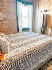 218/220 N Main St, Maryville, MO 64468 - bedroom featuring brick wall