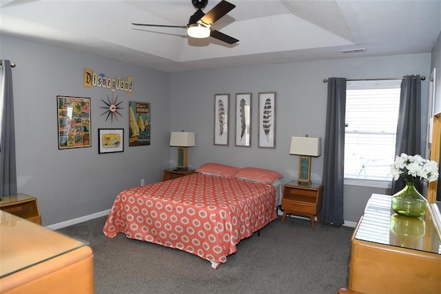 bedroom featuring ceiling fan and dark carpet