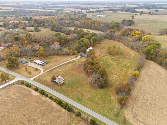 birds eye view of property with a rural view