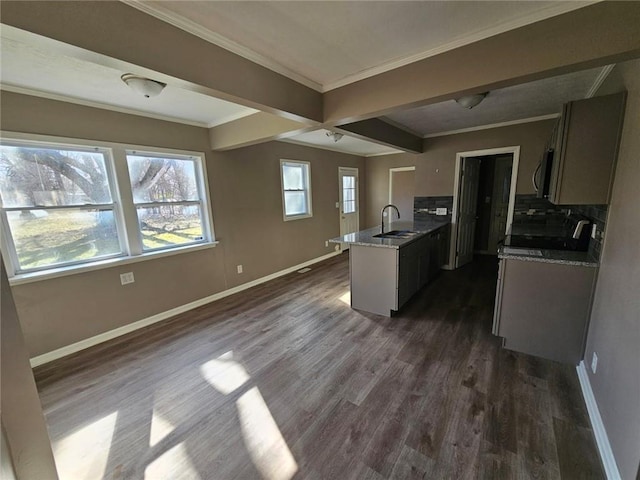 kitchen featuring sink, range, ornamental molding, dark hardwood / wood-style floors, and decorative backsplash