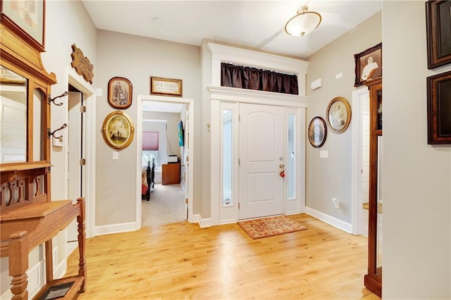 entrance foyer with light hardwood / wood-style floors