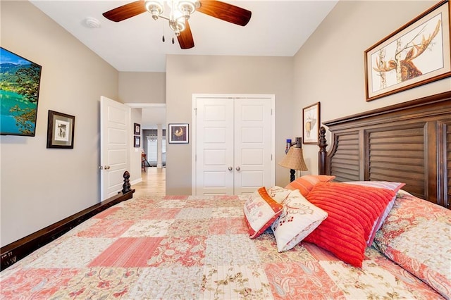 bedroom with ceiling fan and a closet