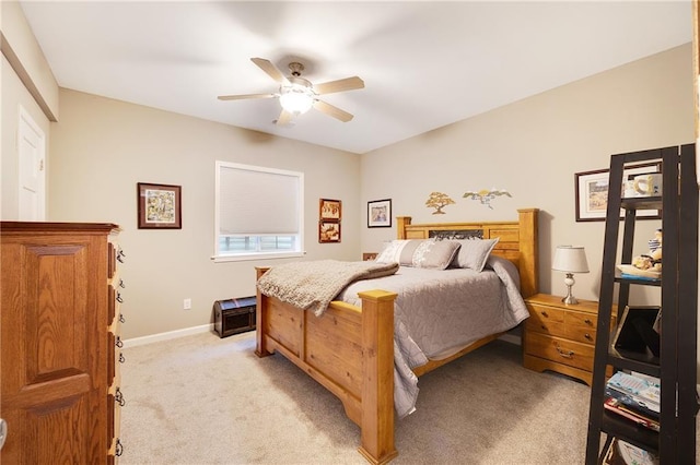 bedroom with light colored carpet and ceiling fan