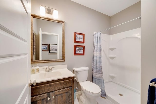 bathroom with vanity, a shower with curtain, and toilet