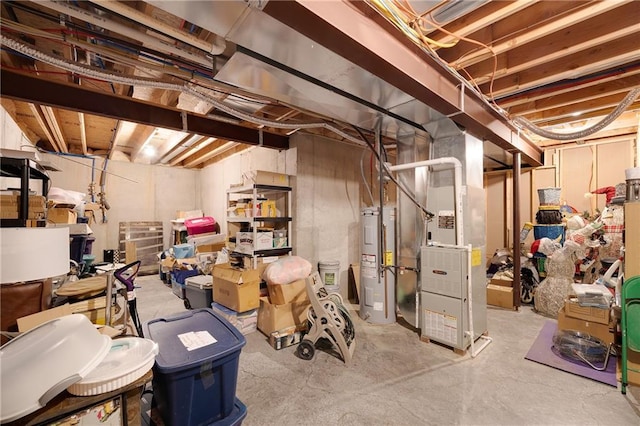 basement featuring electric water heater and heating unit