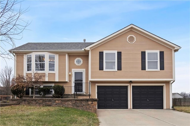 raised ranch featuring a garage