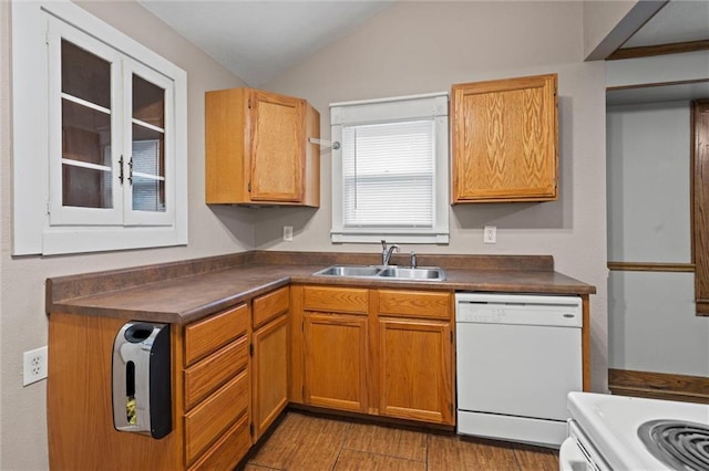 kitchen with hardwood / wood-style flooring, white appliances, lofted ceiling, and sink