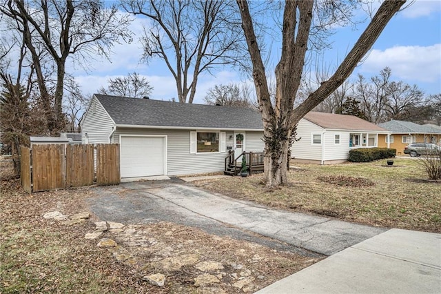 ranch-style house featuring a garage