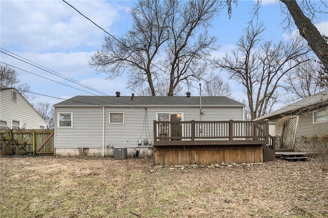 rear view of house with a wooden deck and central AC