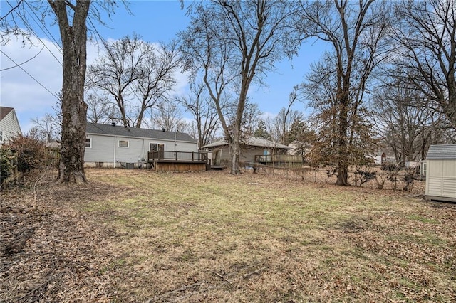 view of yard with a wooden deck