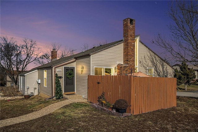 view of property exterior at dusk