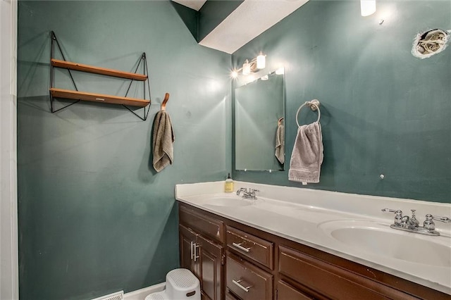 bathroom featuring double vanity and a sink