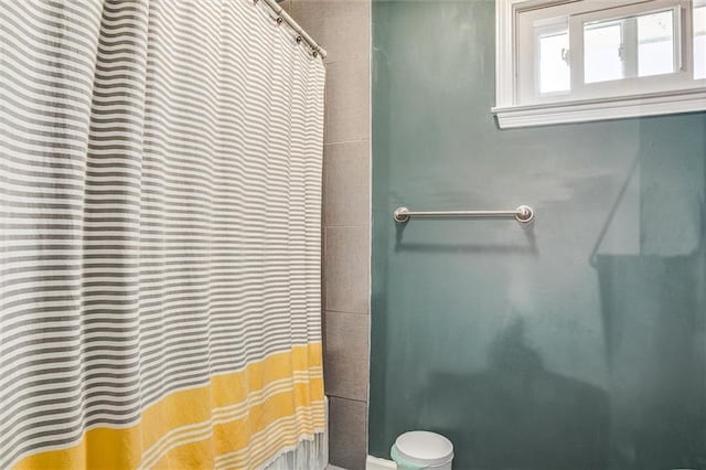 bathroom featuring a shower with curtain